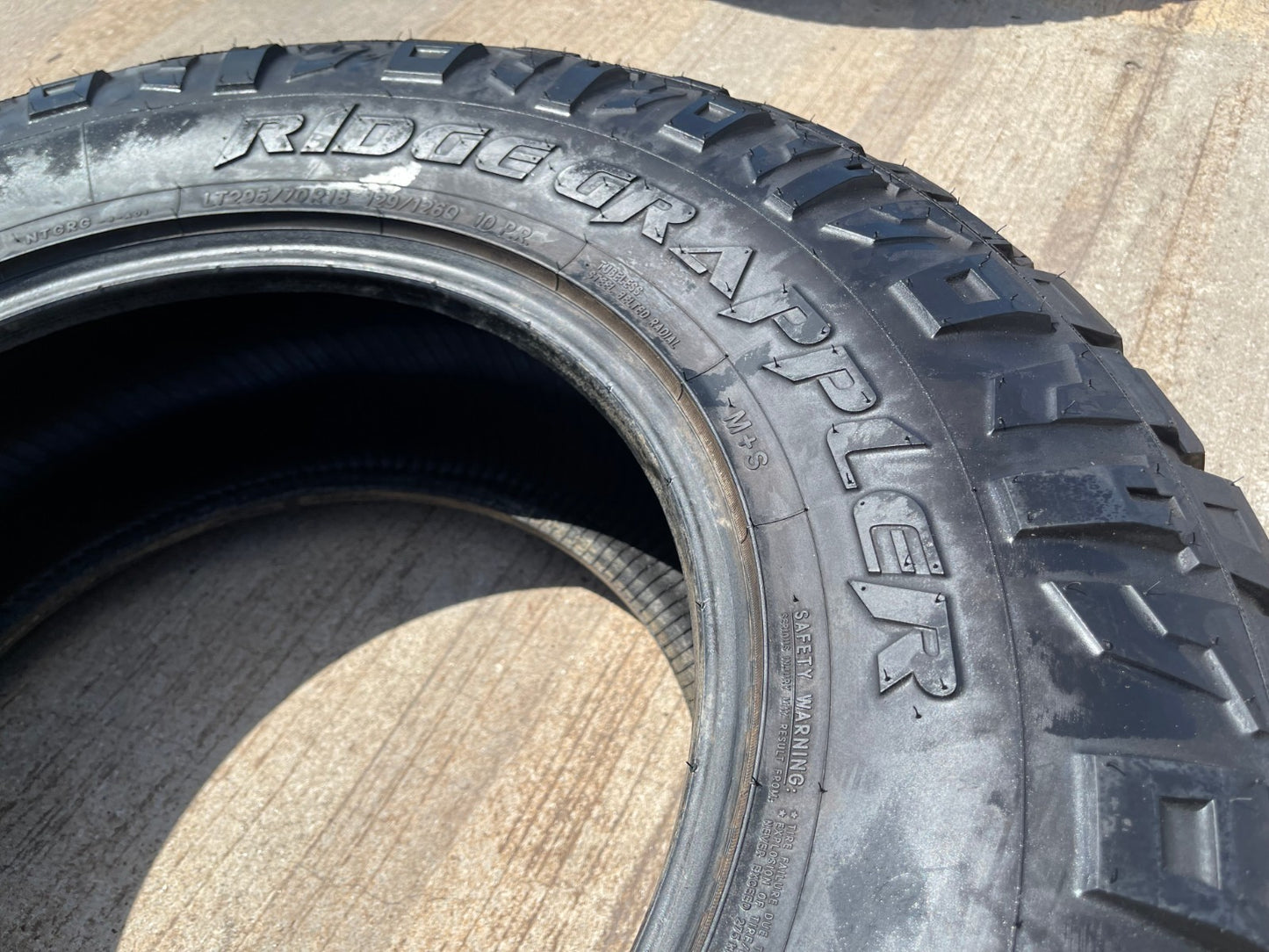 (1) 295/70/18 Nitto Ridge Grappler R/T tire 126Q E LT 10 PLY