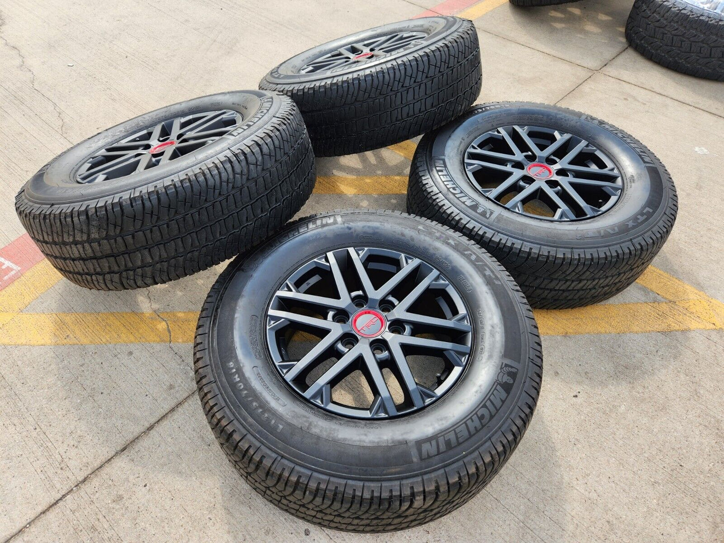 18" Toyota Tundra TRD OEM wheels rims 75281 black Sequoia LX600 tires MICHELIN