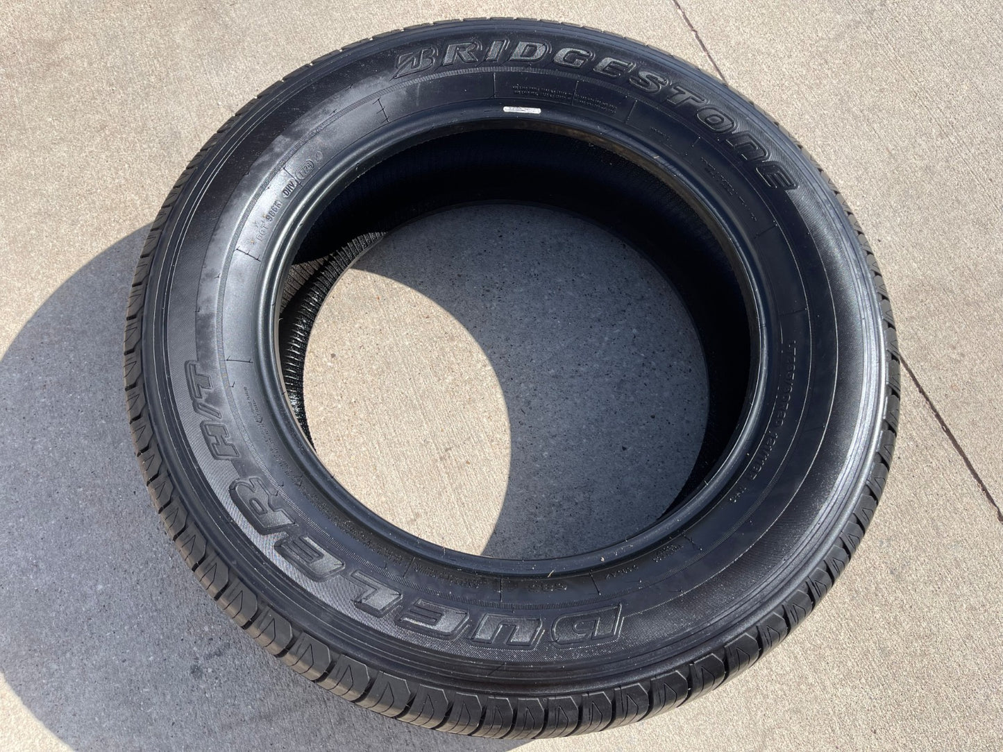 (1) 265/60/20 Bridgestone Dueler H/T tire 121R M+S 265/60R20 LT 10 ply LR E