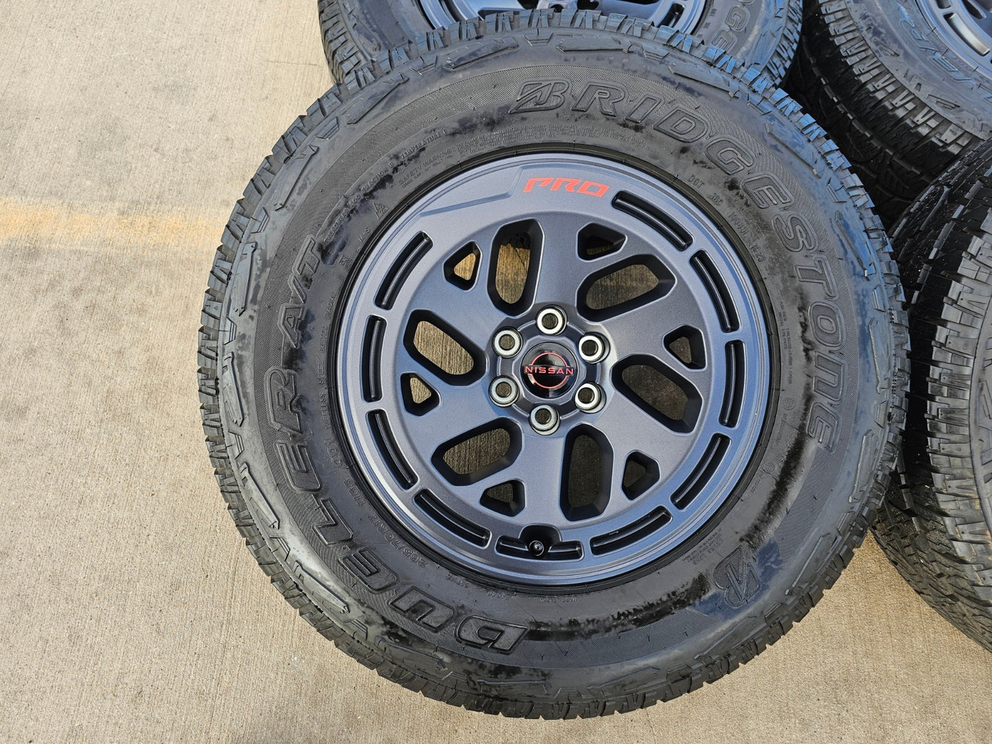 17" Nissan Frontier X-PRO OEM Desert Runner wheels rims tires DUELER A/T