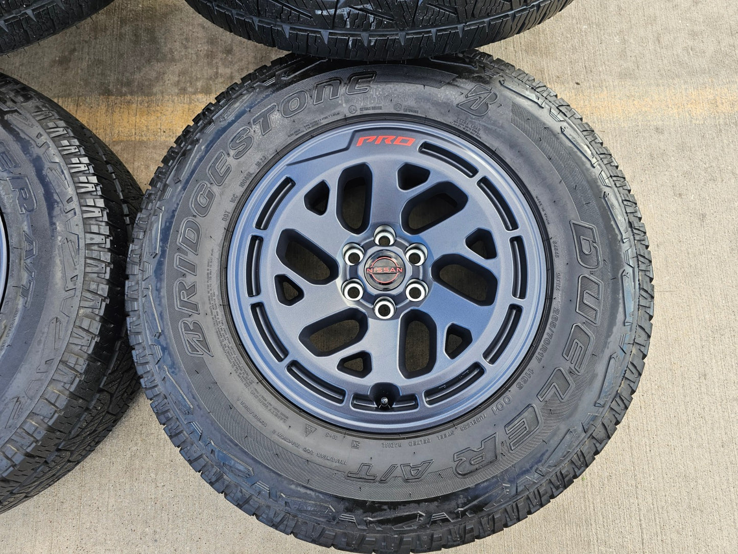 17" Nissan Frontier X-PRO OEM Desert Runner wheels rims tires DUELER A/T