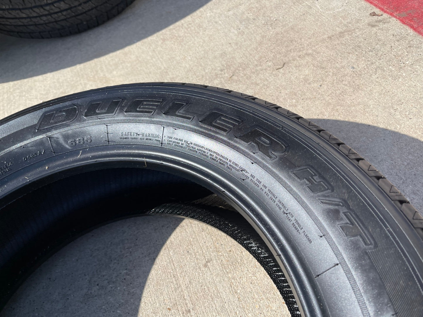 (1) 265/60/20 Bridgestone Dueler H/T tire 121R M+S 265/60R20 LT 10 ply LR E