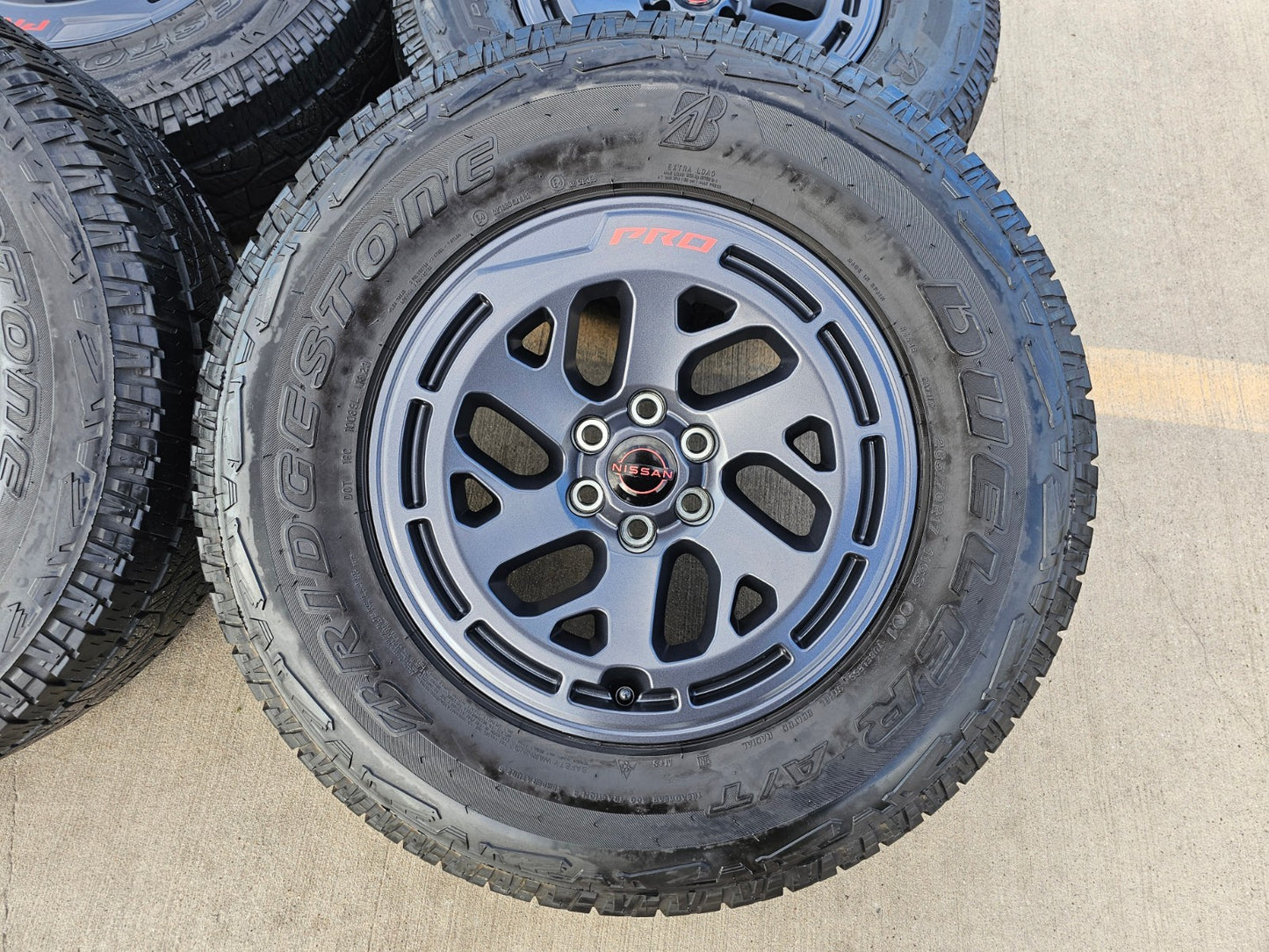 17" Nissan Frontier X-PRO OEM Desert Runner wheels rims tires DUELER A/T