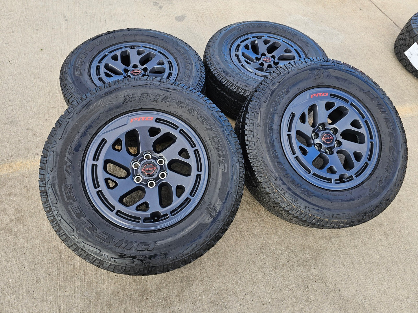 17" Nissan Frontier X-PRO OEM Desert Runner wheels rims tires DUELER A/T