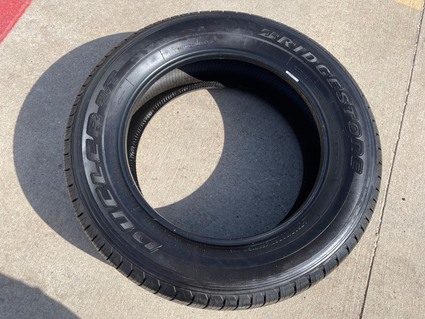 (1) 265/60/20 Bridgestone Dueler H/T tire 121R M+S 265/60R20 LT 10 ply LR E