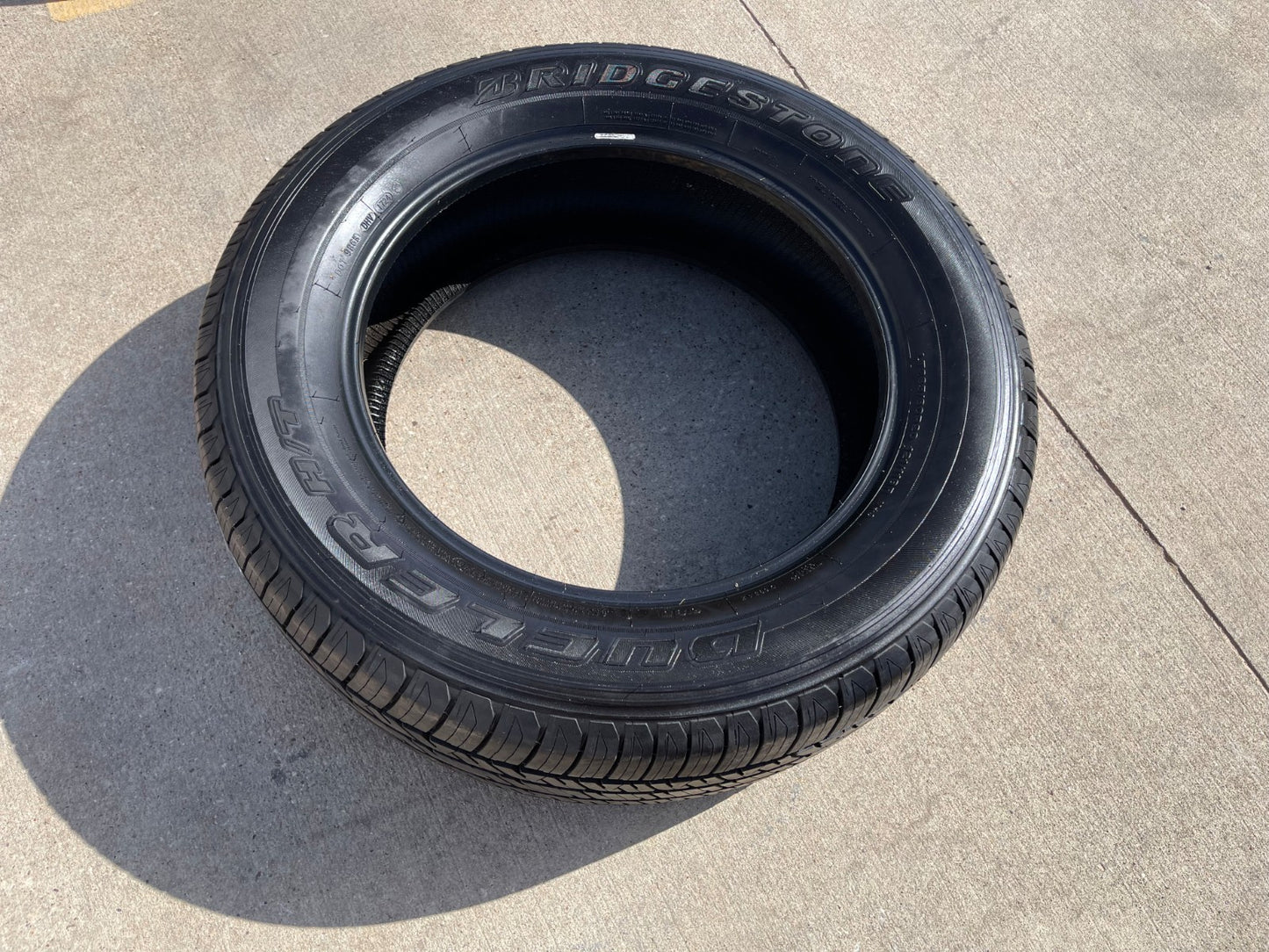 (1) 265/60/20 Bridgestone Dueler H/T tire 121R M+S 265/60R20 LT 10 ply LR E