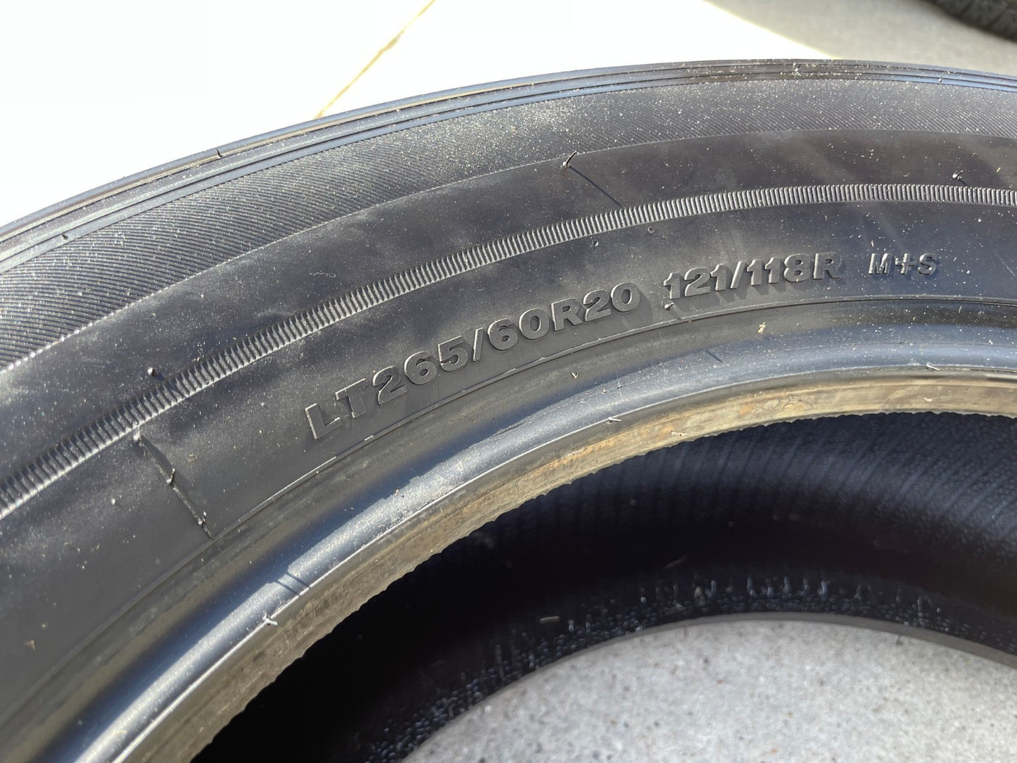 (1) 265/60/20 Bridgestone Dueler H/T tire 121R M+S 265/60R20 LT 10 ply LR E